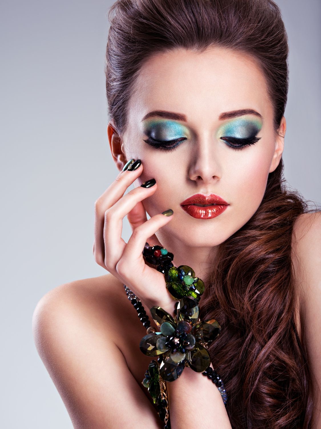 beautiful woman face with fashion green make up jewelry hand 1